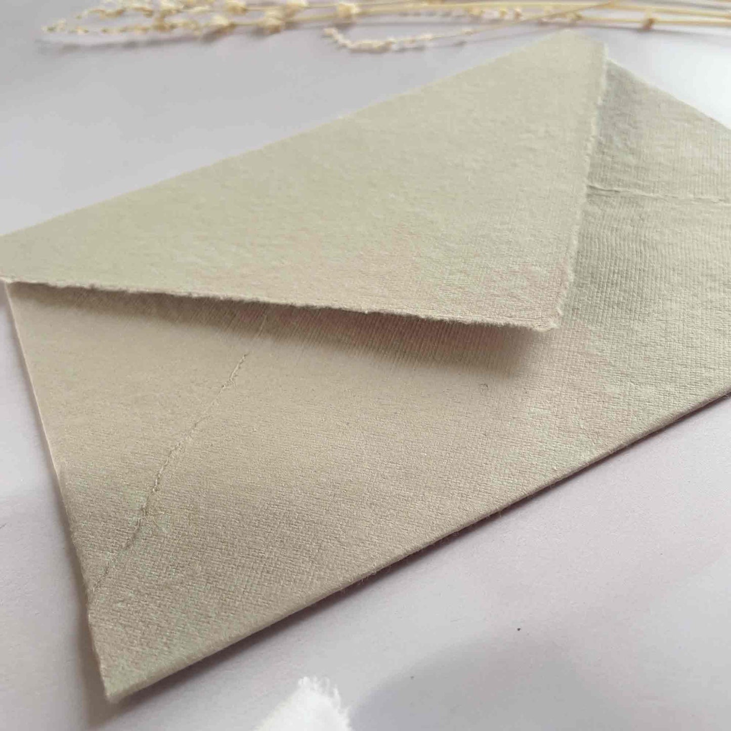 Beige handmade paper envelopes made from recycled cotton rag paper.  By The Natural Paper Company