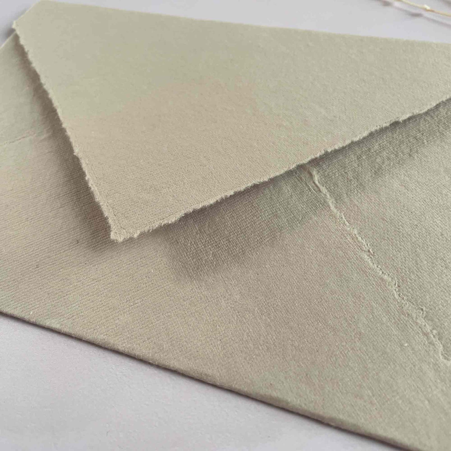 Deckle edge handmade paper envelope with pointed flap.  Mushroom handmade cotton rag paper envelope by The Natural Paper Company