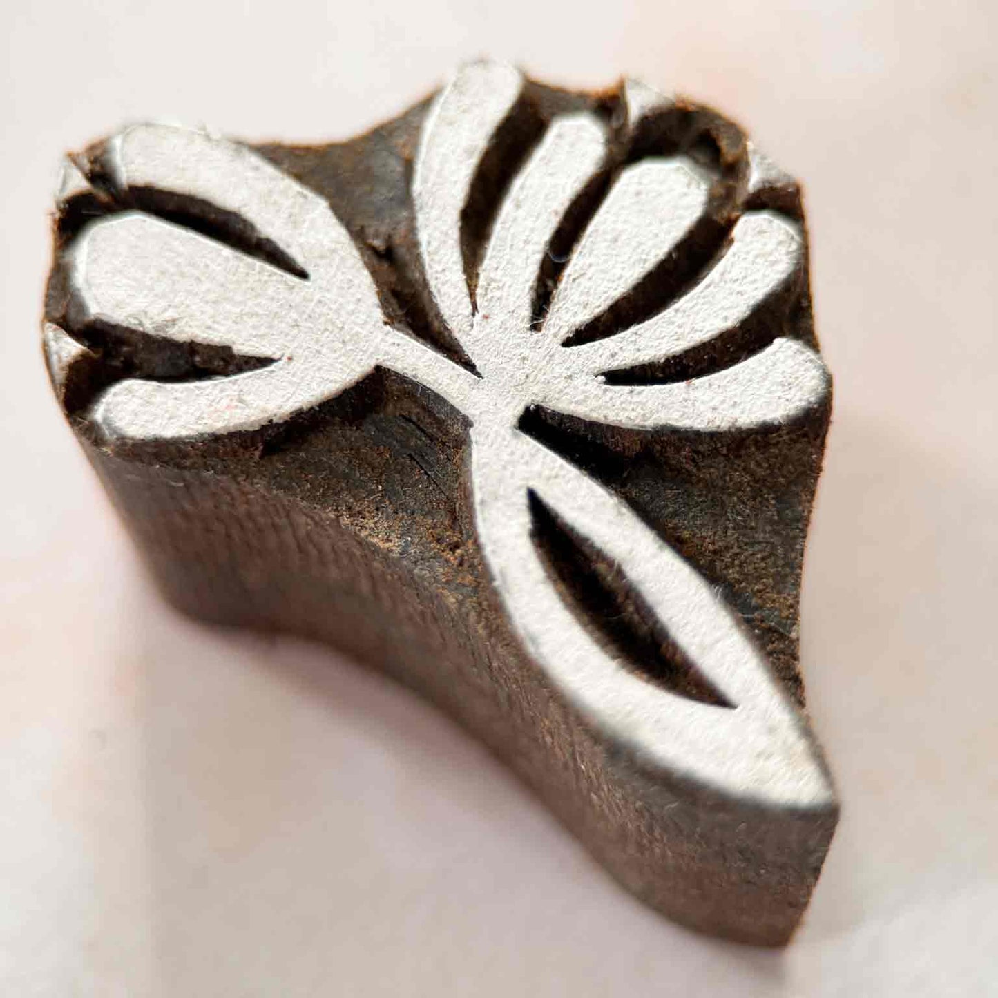Nalini Indian Wood Block Stamp featuring a stylised lotus-inspired botanical design with curved petals and leaves.