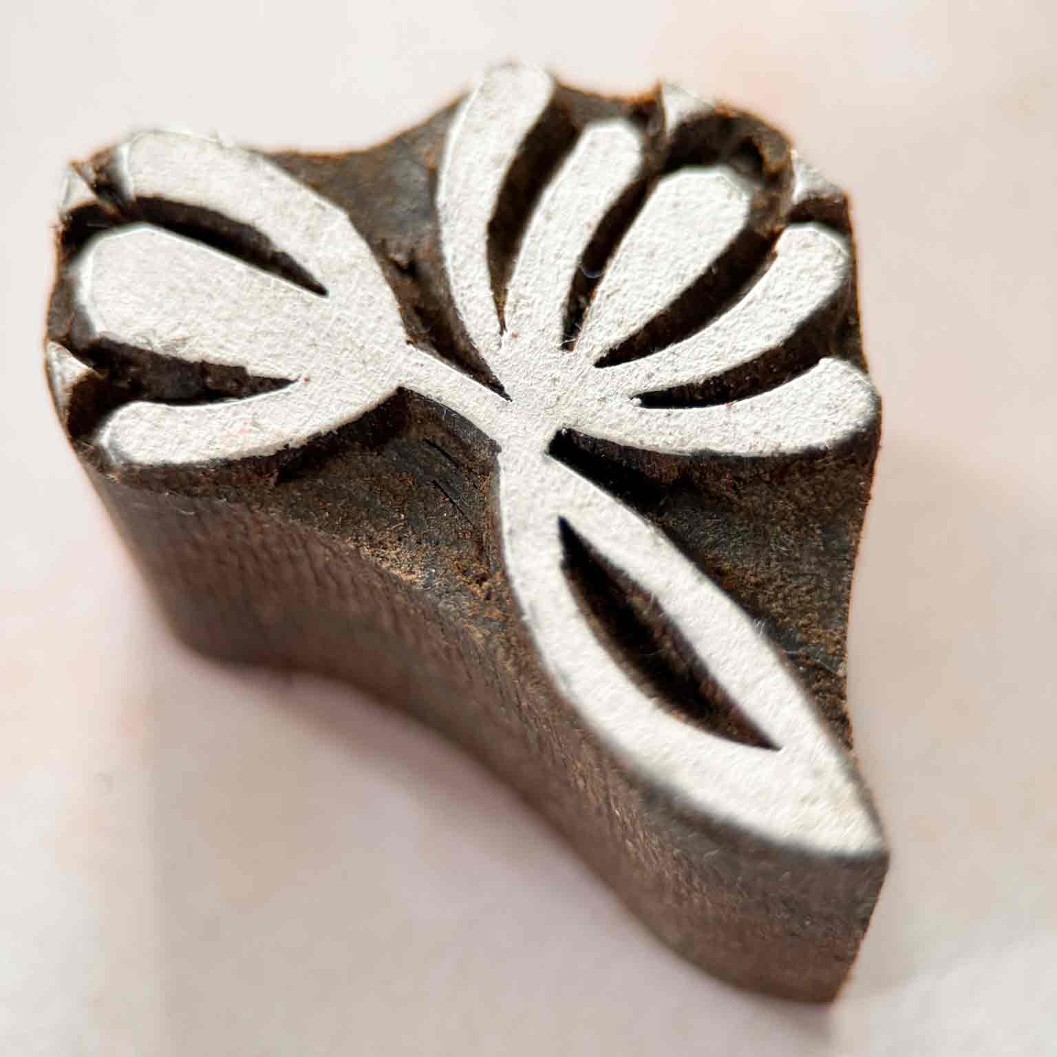 Nalini Indian Wood Block Stamp featuring a stylised lotus-inspired botanical design with curved petals and leaves.
