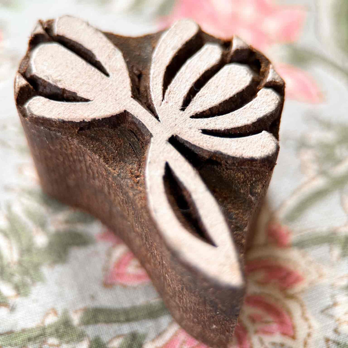 Close-up Nalini Traditional Printing Block with flowing botanical petals for fabric, textile and paper printing.