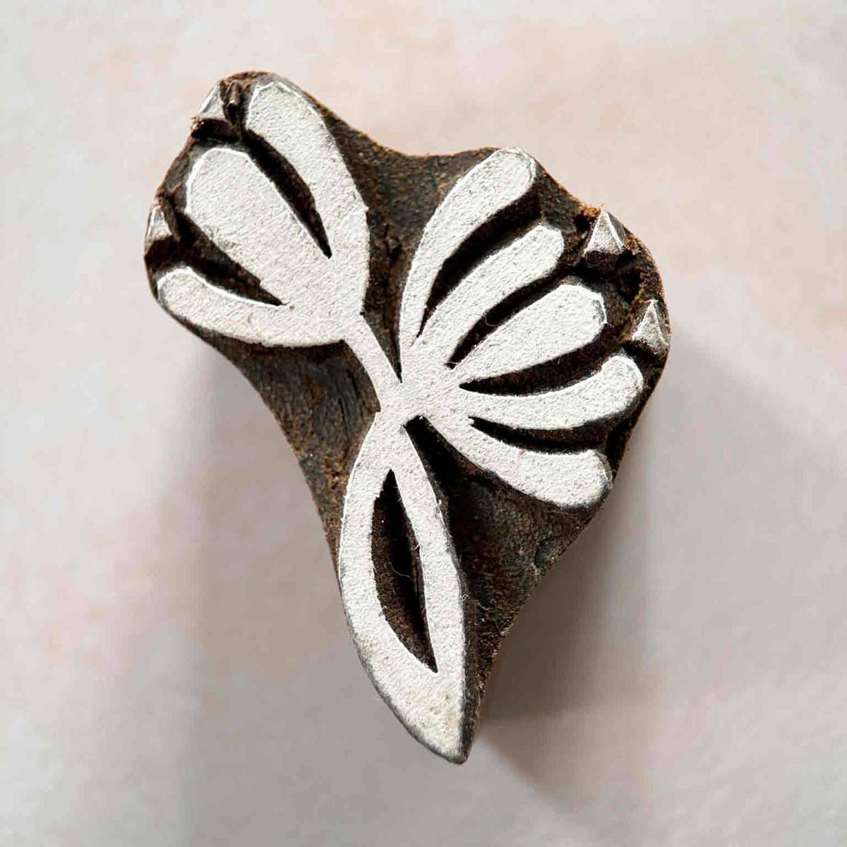 Nalini hand-carved Indian Wooden Stamp showing its stylised lotus design and traditional artisan finish.