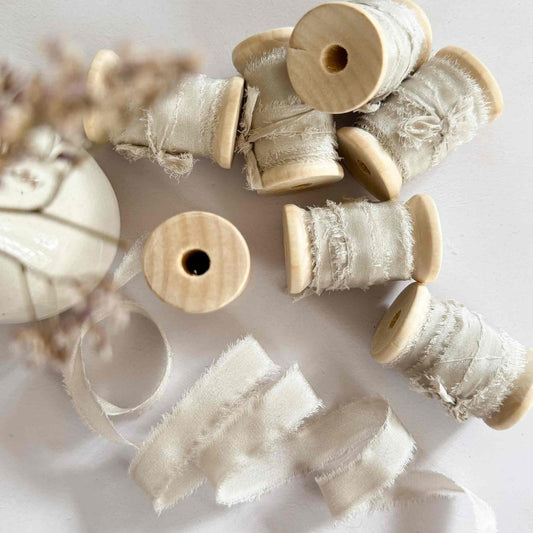 Narrow silk ribbon for decorating place cards and tags.  Fine silk ribbon in a neutral beige colour