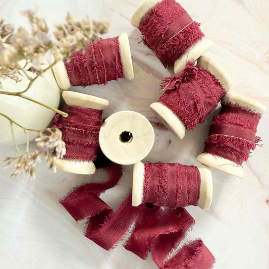 10mm silk ribbon in burgundy.  Narrow silk ribbon for place cards and tags