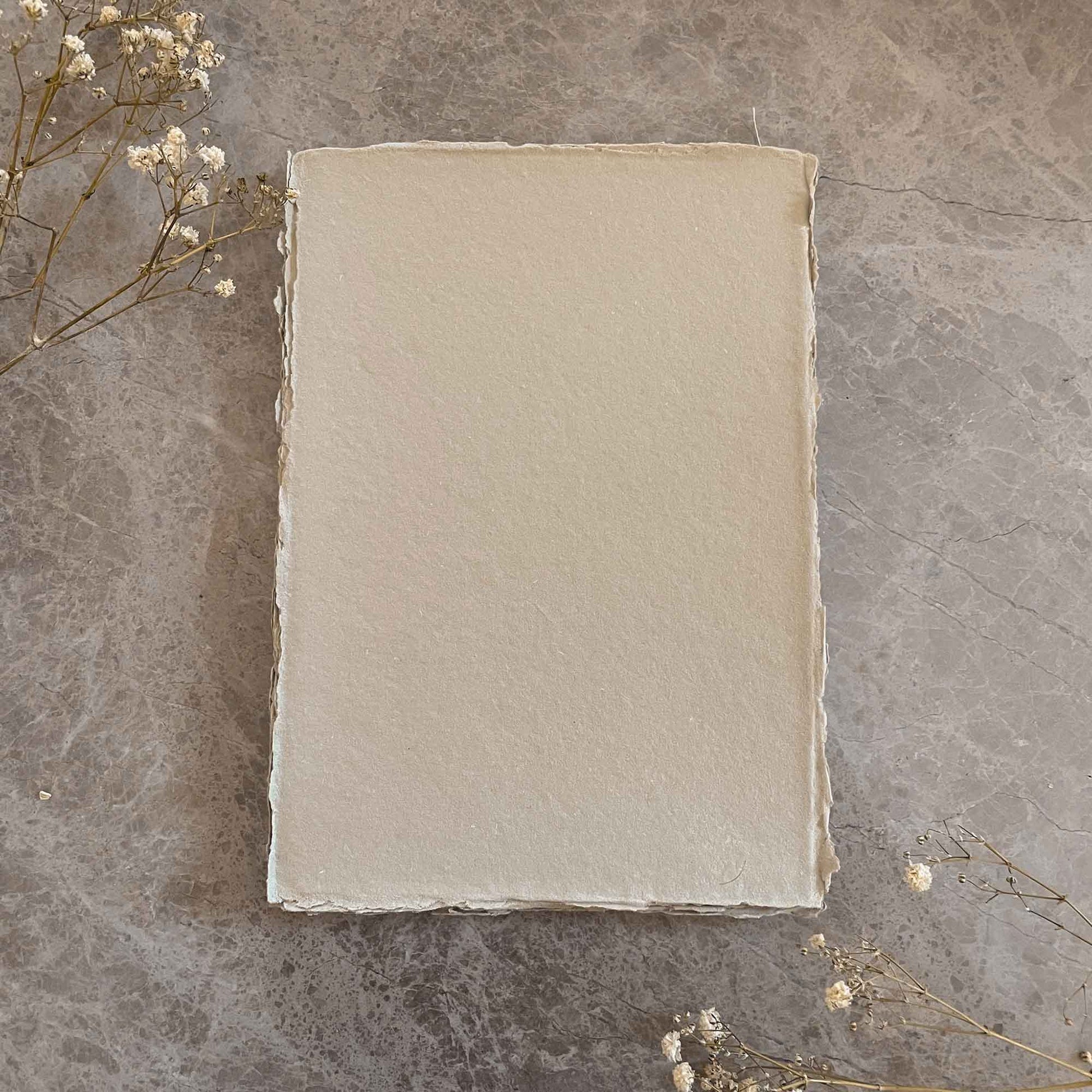 A4 sheets of natural handmade paper with deckled edges.  By The Natural Paper Company