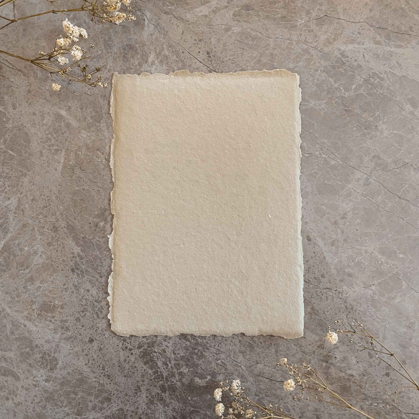 natural handmade paper with deckled edges,  Made from recycled cotton rag fibres.  