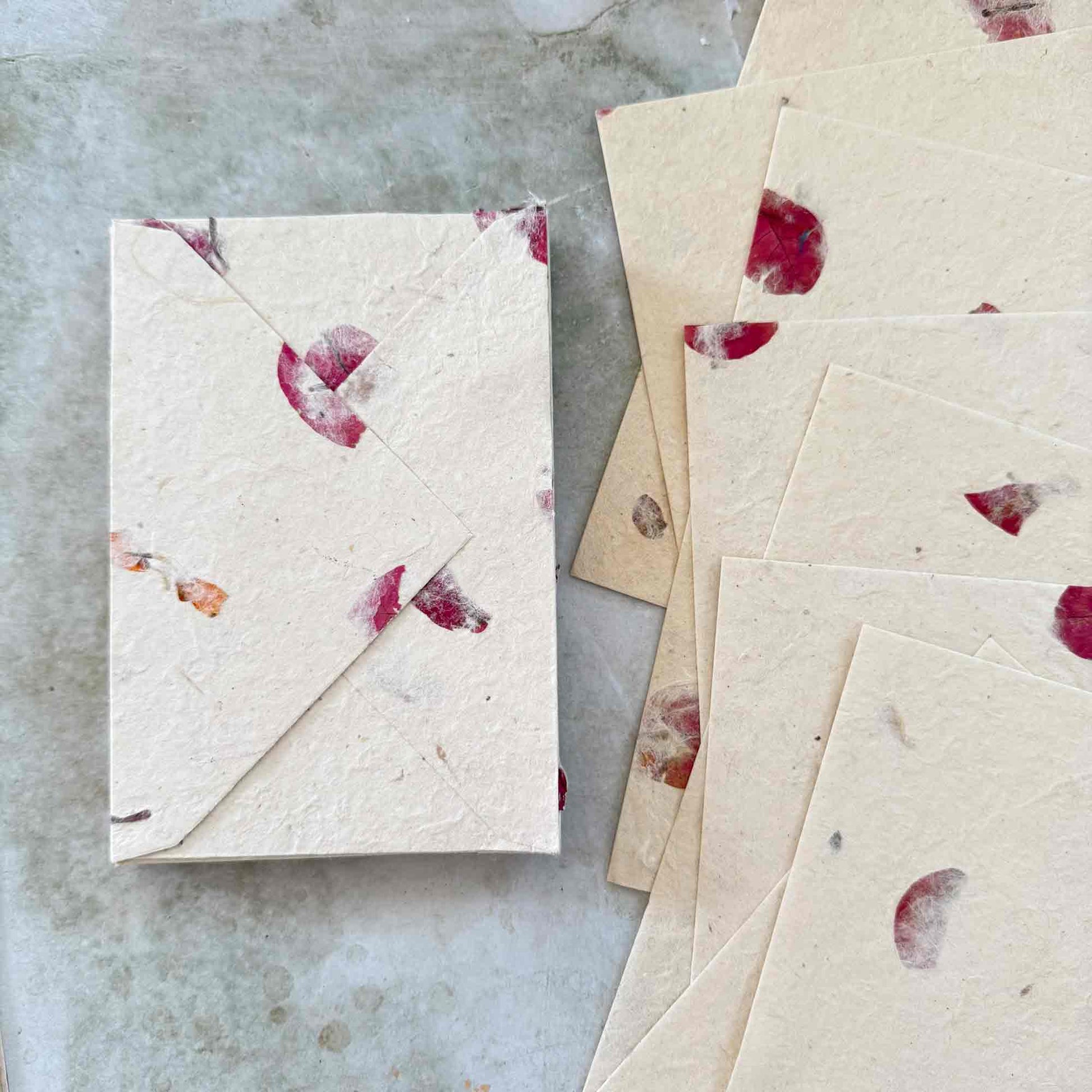 Handmade nepalese lokta paper envelopes with bougainvillea petals