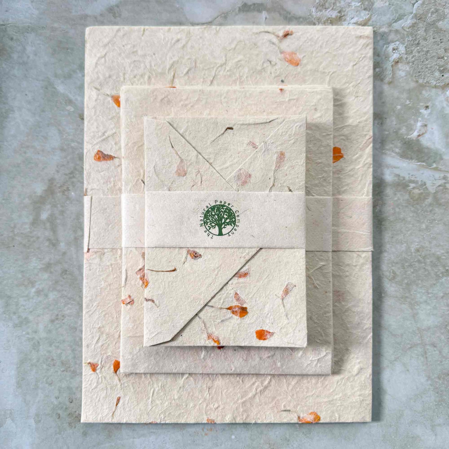 handmade lokta paper and envelopes with marigold flower petals
