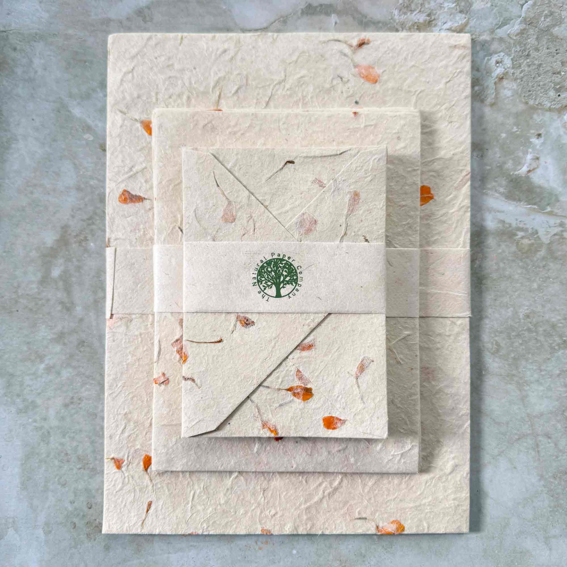 handmade lokta paper and envelopes with marigold flower petals
