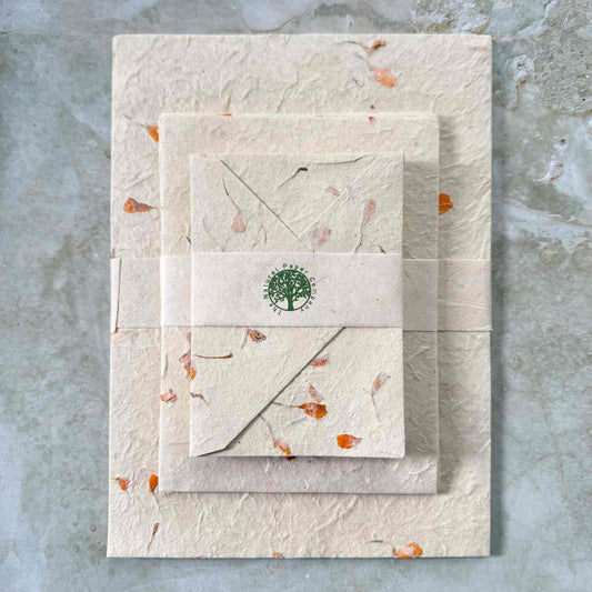 handmade lokta paper and envelopes with marigold flower petals
