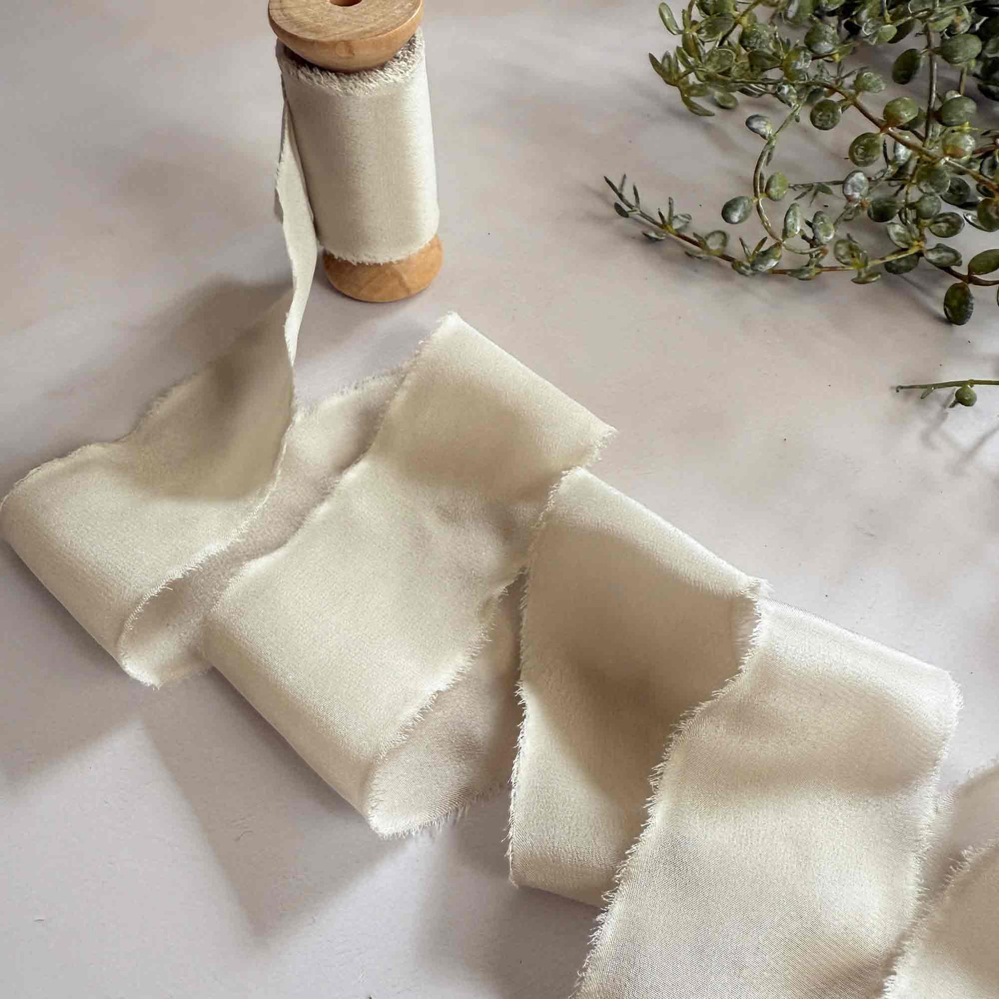Neutral wide silk tibbon.