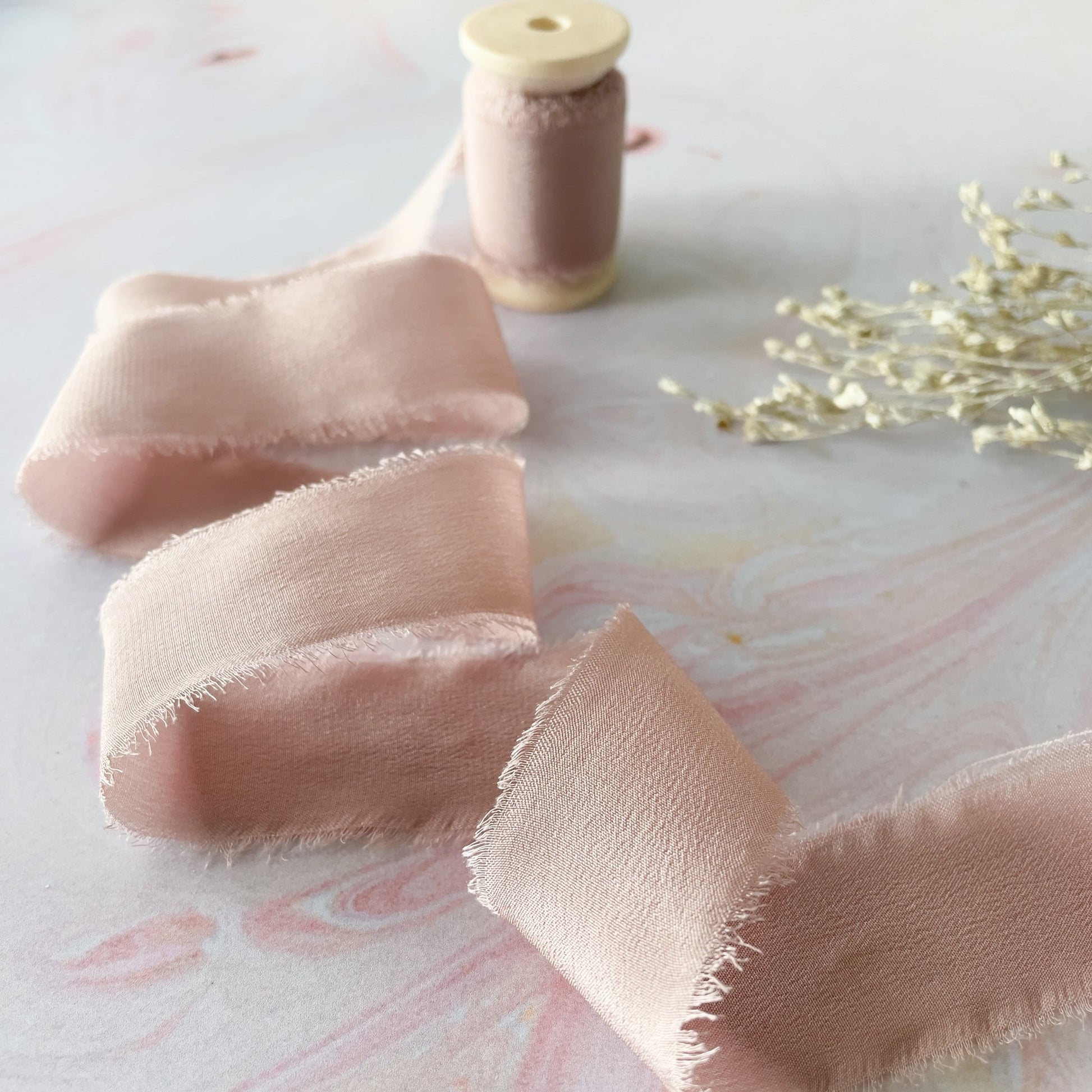 Fine silk ribbon in nude pink.  Luxury habotai silk ribbon with a frayed edge.  By The Natural Paper Company.