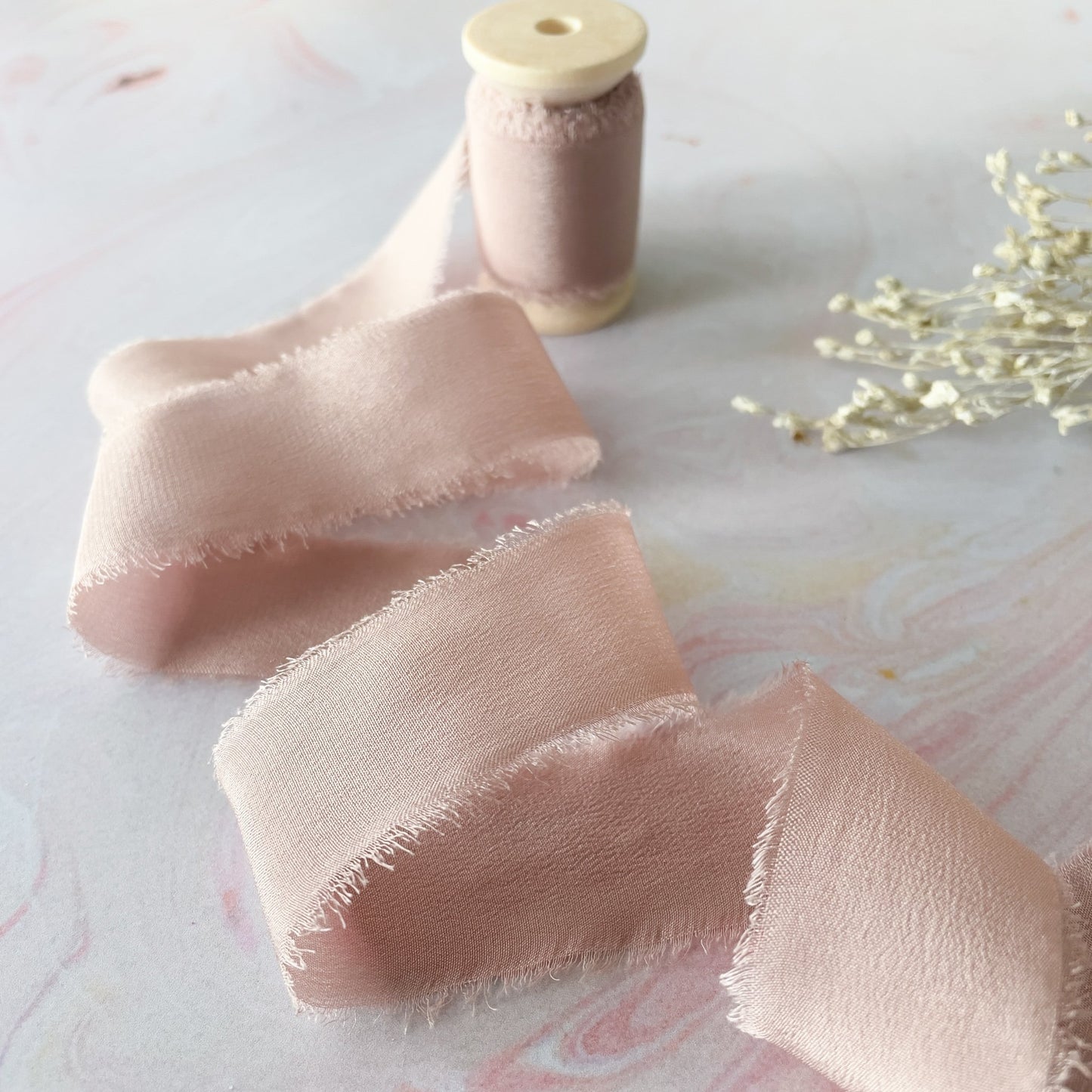 Nude pink silk ribbon.  Luxury silk ribbon with a frayed edge.  Decorative ribbon for wedding stationery, invitations, crafts and floristry.  By The Natural Paper Company.