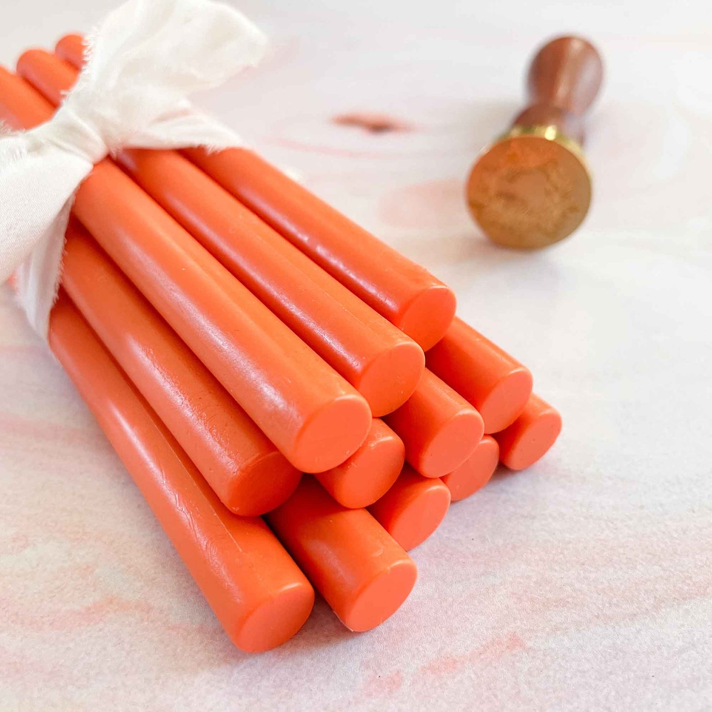 bright orange wax seal sticks.  1mm glue gun sealing wax