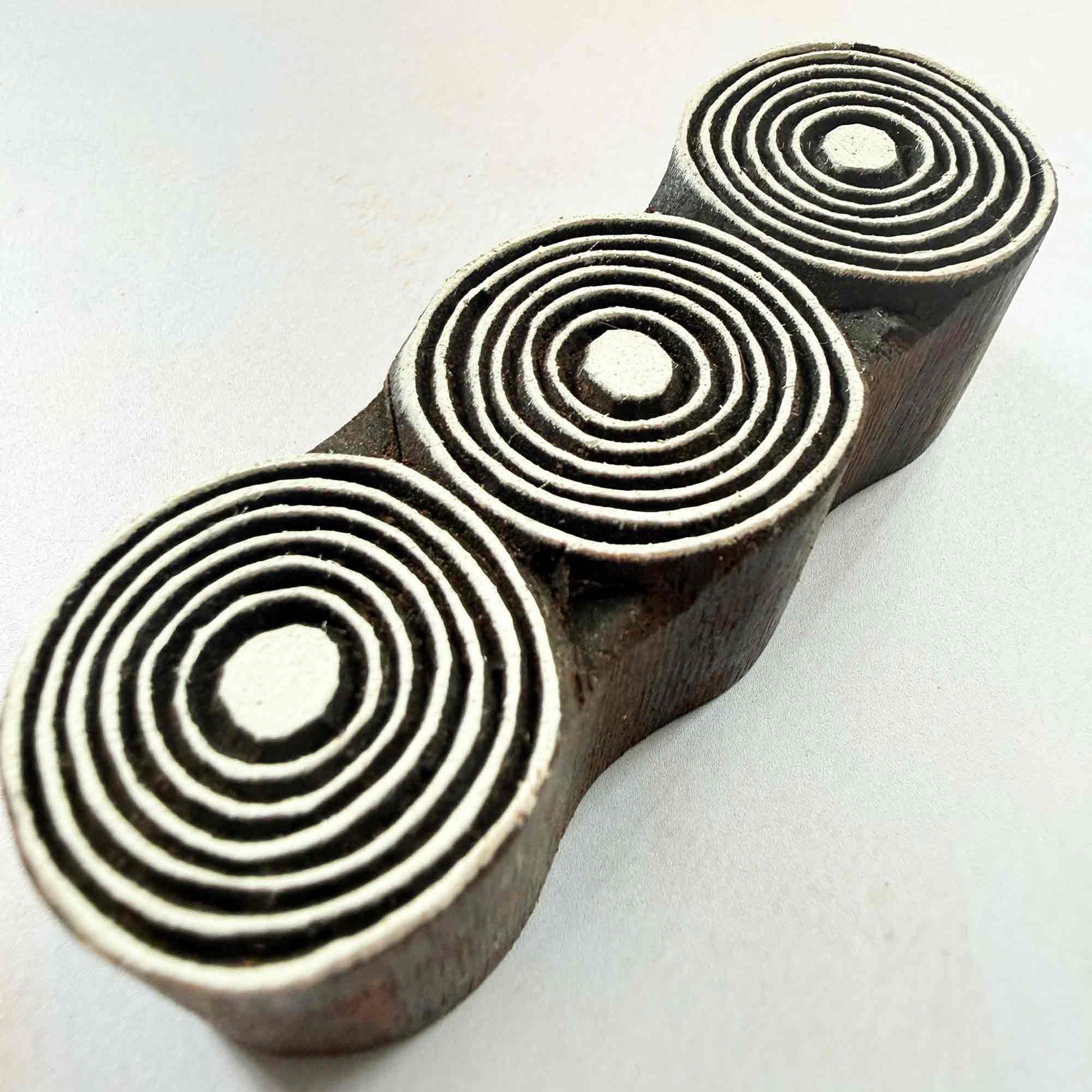 Orbits wooden stamp — three connected concentric circles viewed from side, handcrafted Indian printing block with fine stepped rings