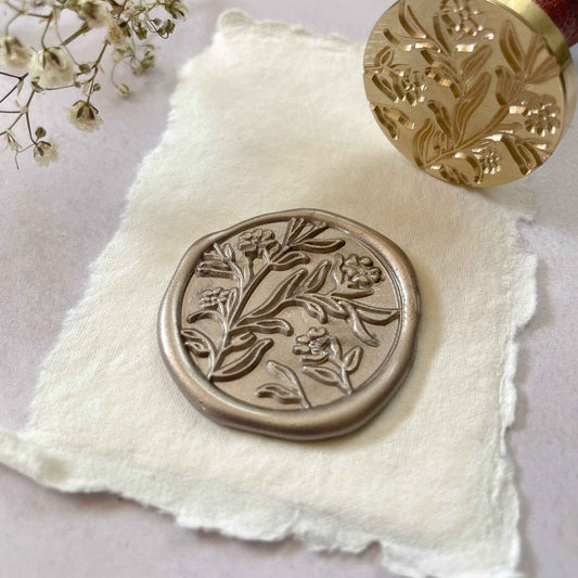 Floral wax seal with flowers and leaves.  Brass stamp for making botanical wax seals to decorate wedding invitations, stationery, gift wrapping and more.  By The Natural Paper Company