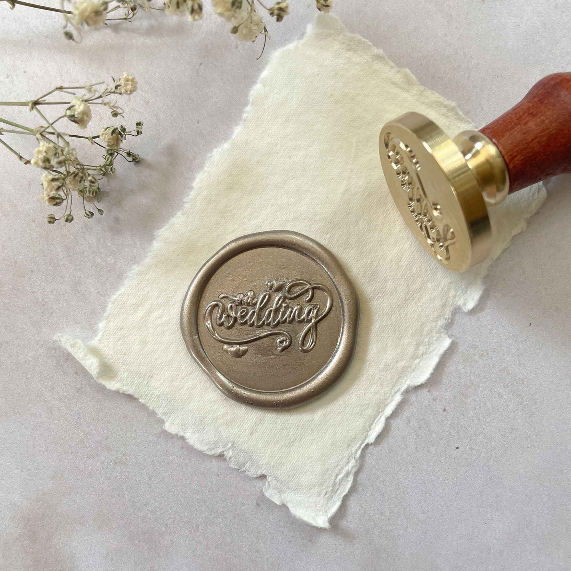 Our wedding stamp to make wax seals.  Calligraphy style sealing wax stamp for wedding invitations and stationery.  By The Natural Paper Company.