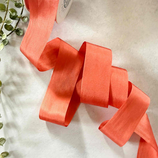 Paprika Silk Ribbon in warm burnt orange with a luxurious sheen and wide 32.5mm closed-edge finish.