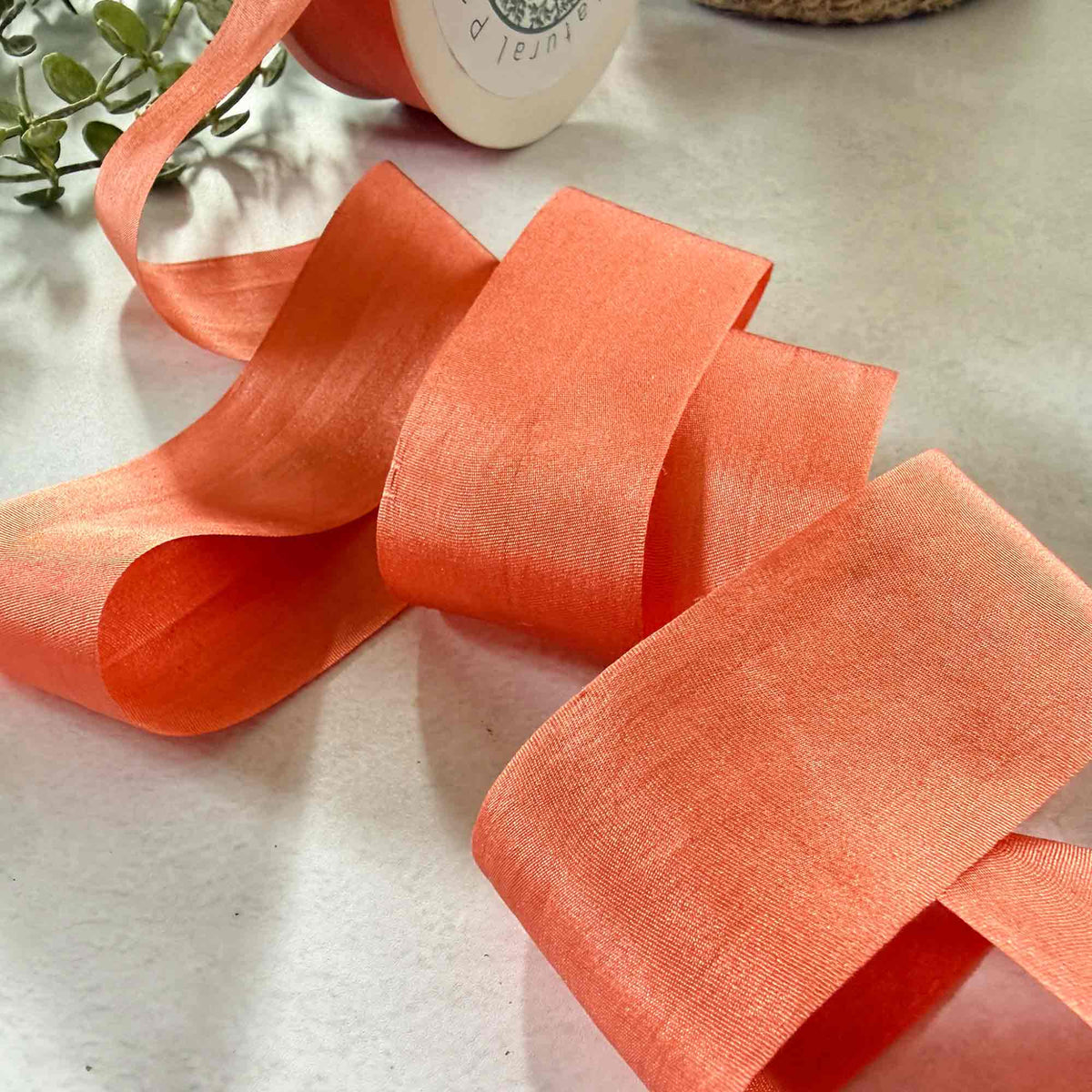 32.5mm Paprika Habotai Silk Ribbon in a warm burnt orange and terracotta shade with closed edges.