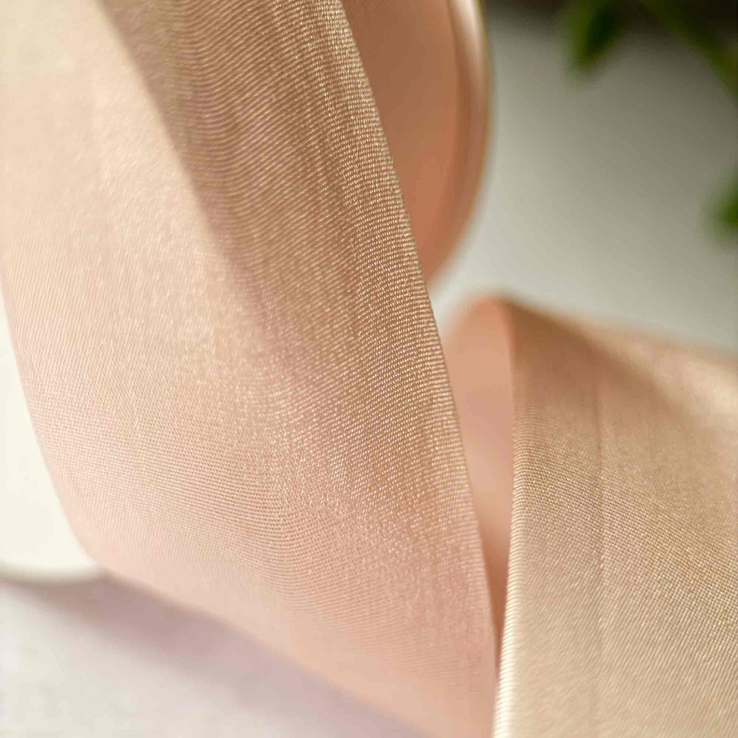 close up image of peach silk ribbon