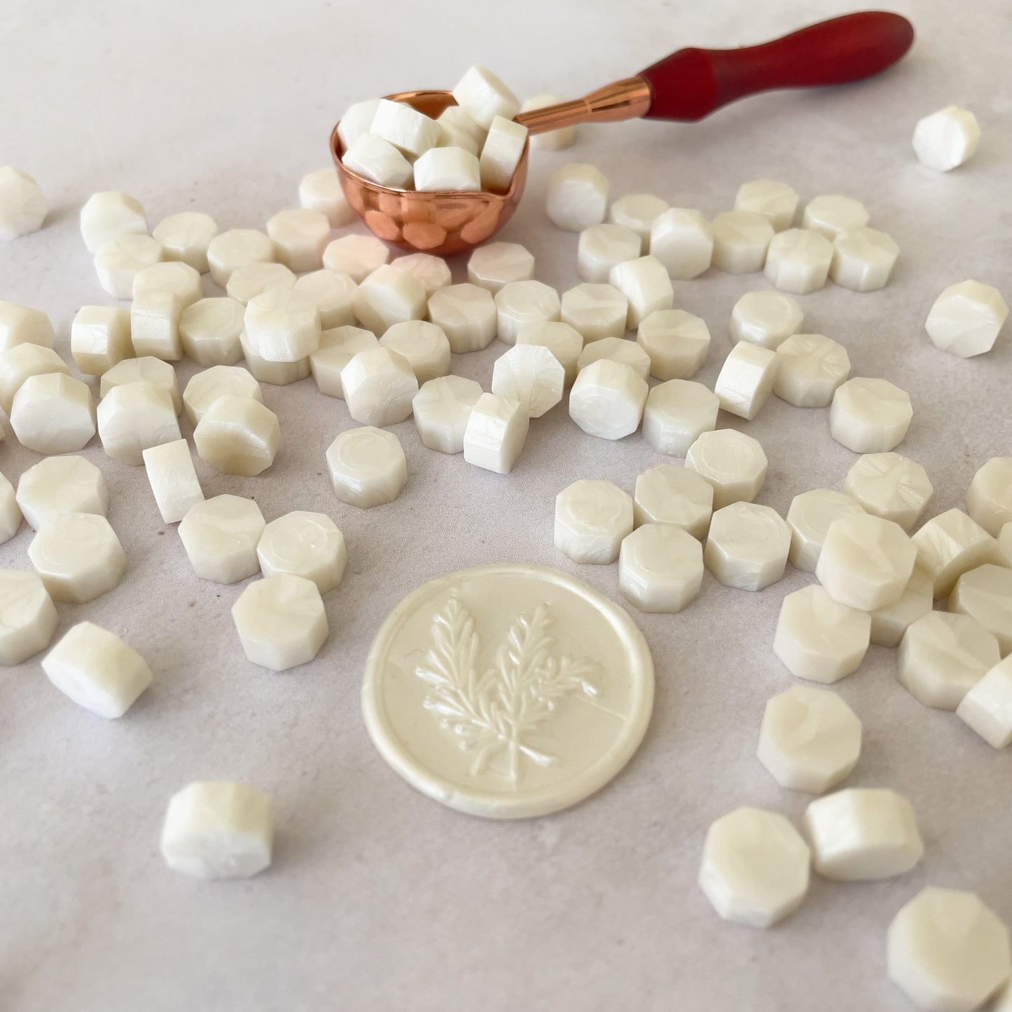 Sealing wax beads in pearlised ivory colour.  Make eco friendly wax seals with these small beads of plastic free wax.  by The Natural Paper Company