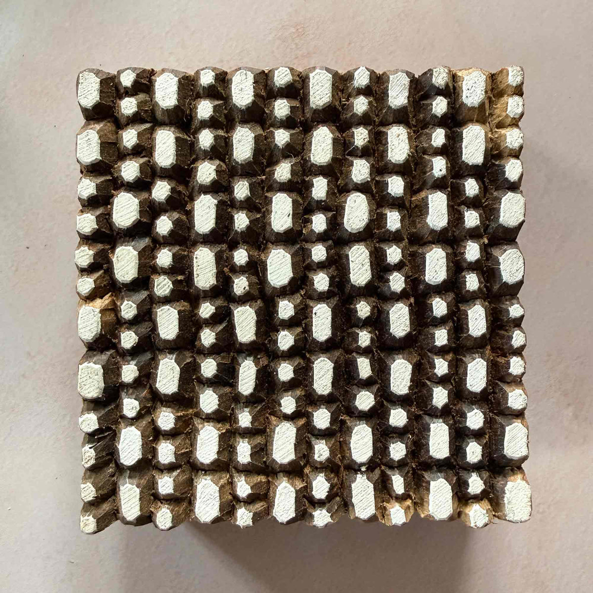 Pebbles Indian Wood Block Stamp measuring 10.5 x 10 cm with a dense hand-carved pattern of irregular pebble-shaped printing marks.