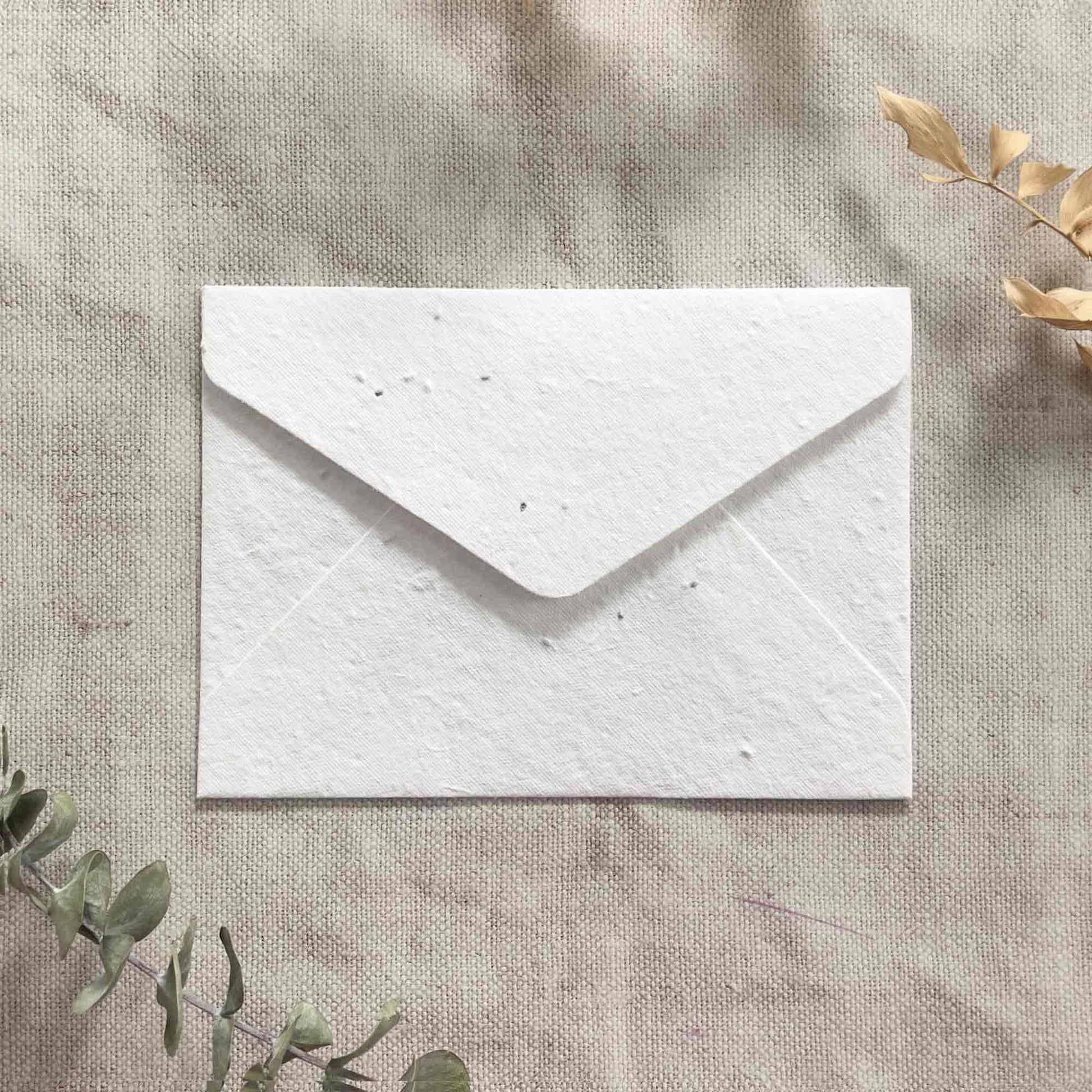 handmade paper envelopes with basil seeds.  Plantable invitation envelopes