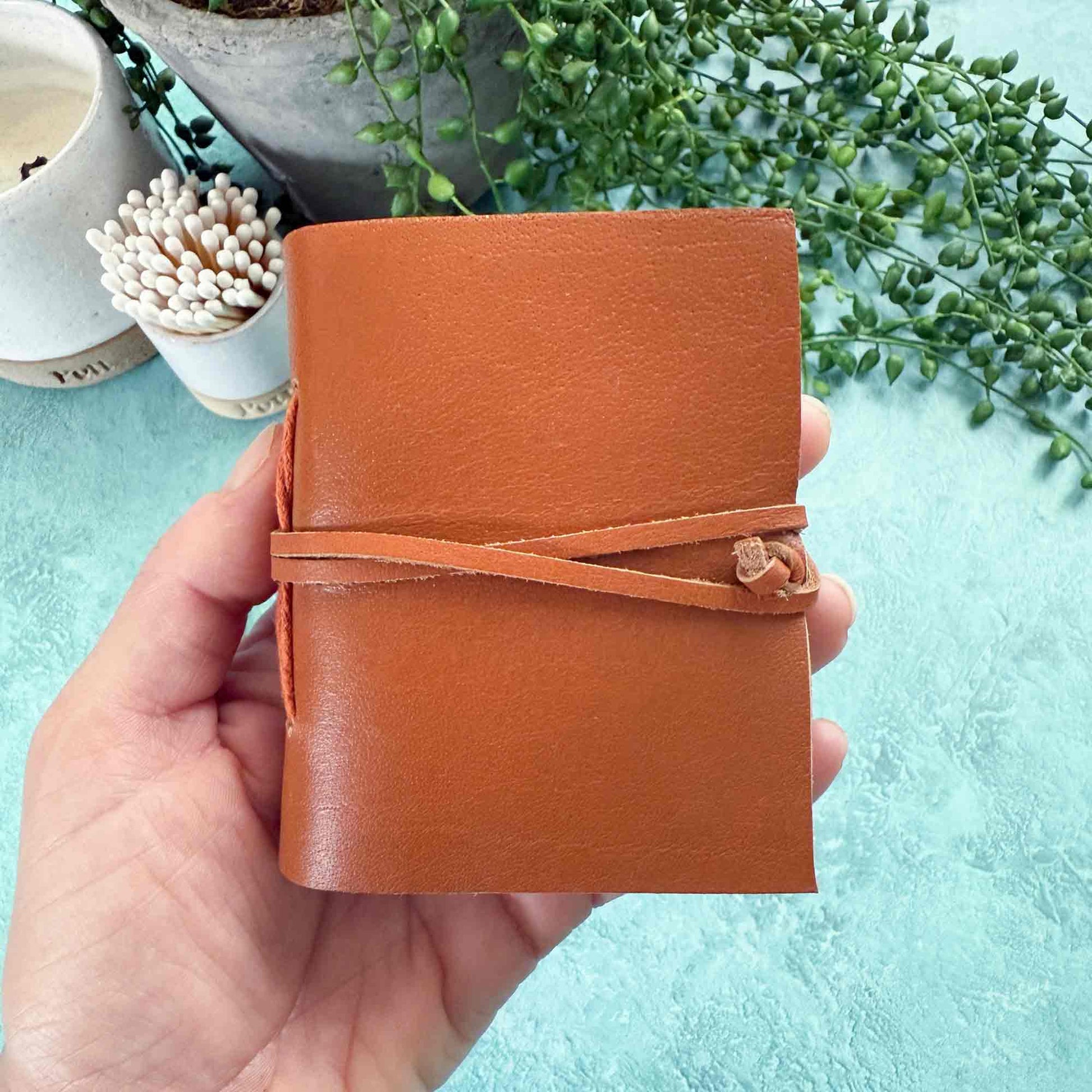 little handmade leather notebook in tan