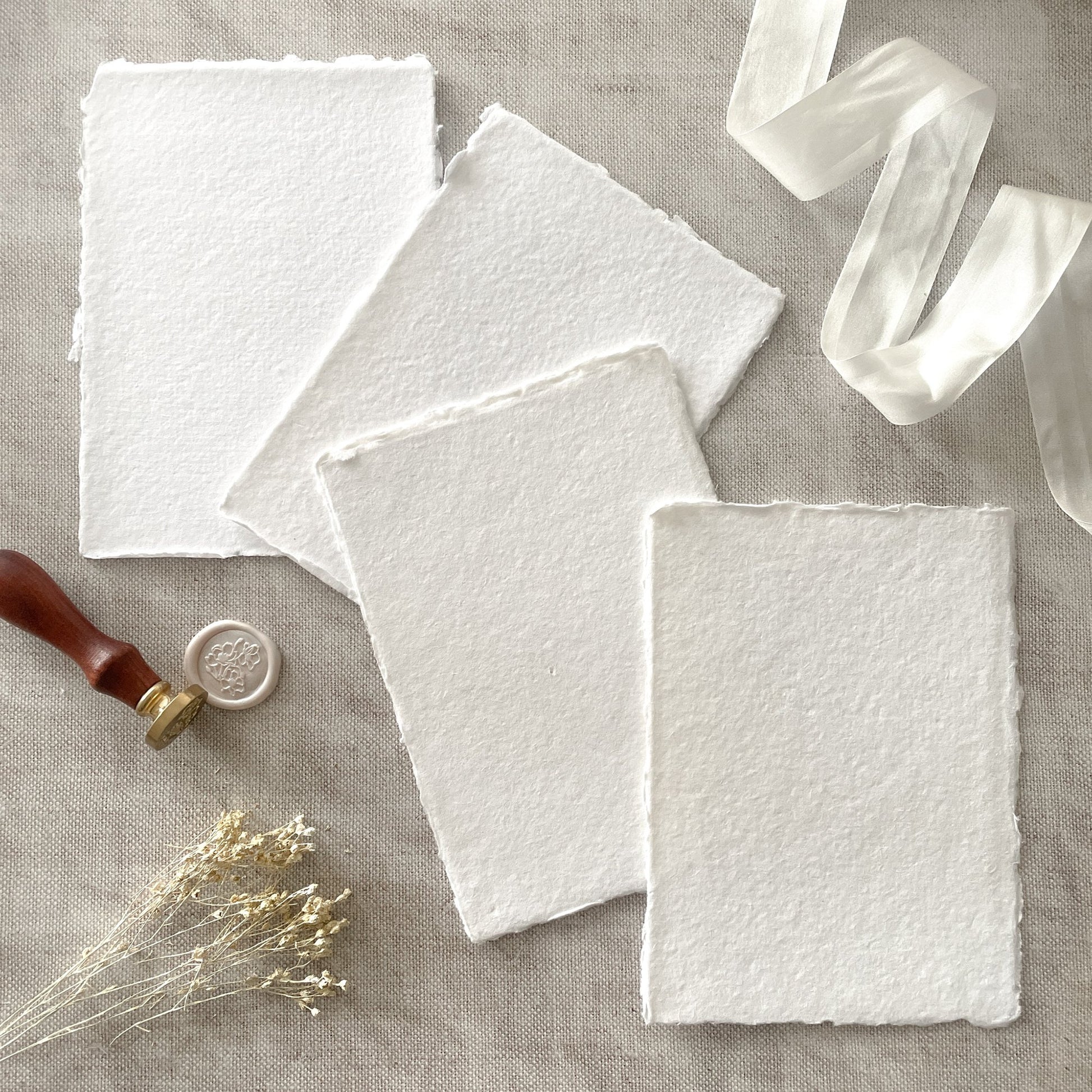 Luxury white handmade paper made from recycled cotton rag.  Deckle edge handmade paper.  Watercolour paper that is suitable for calligraphy.  By The Natural Paper Company