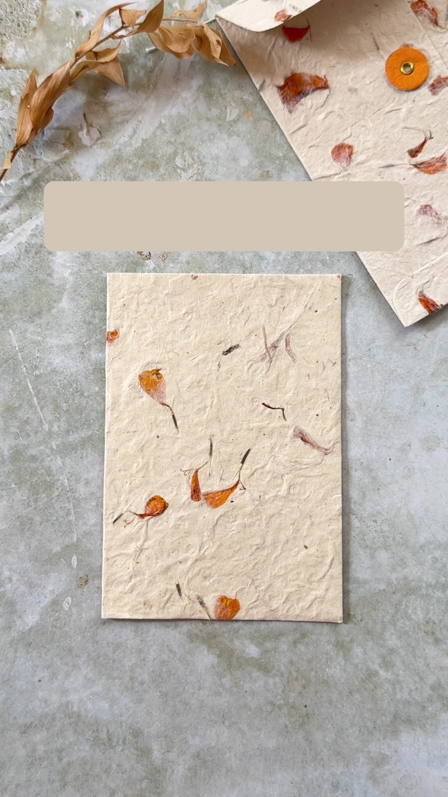 video showing the special qualities of handmade lokta paper with dried flowers.