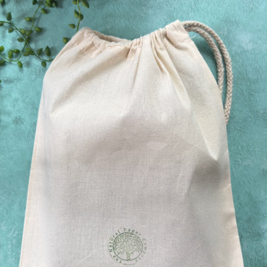 Handmade leather journal in a branded gift bag