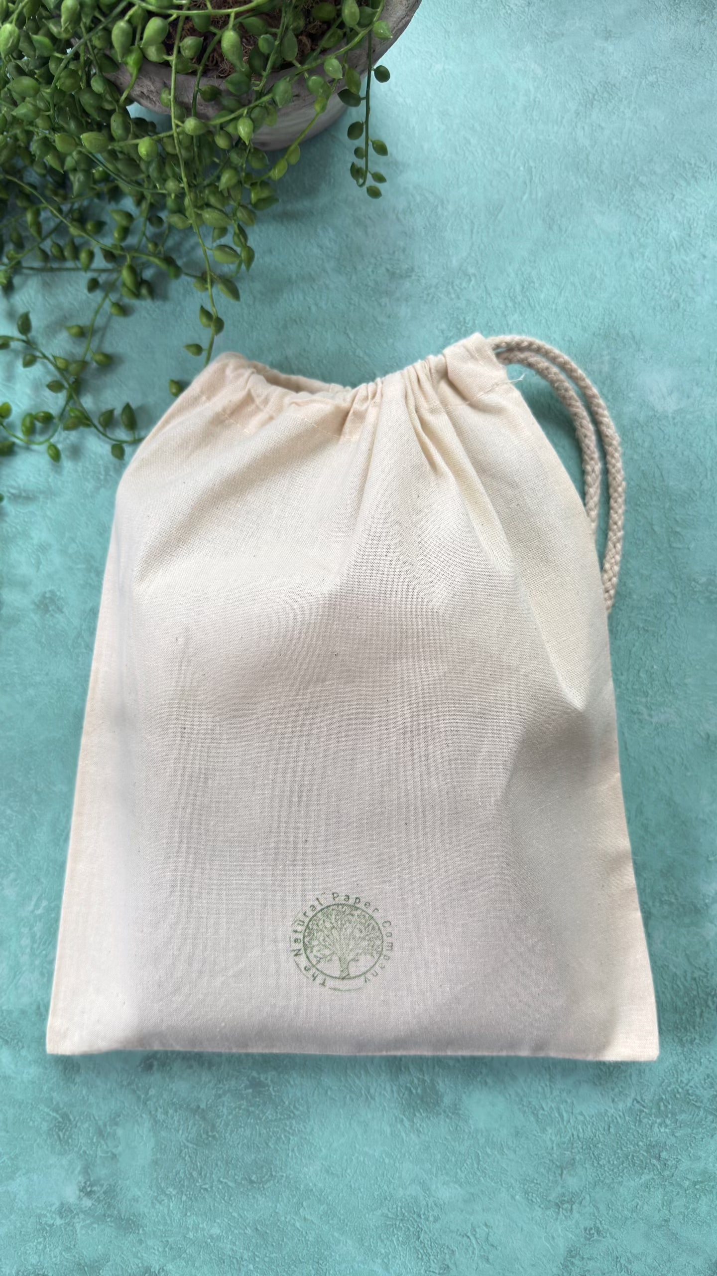 Handmade leather journal in a branded gift bag