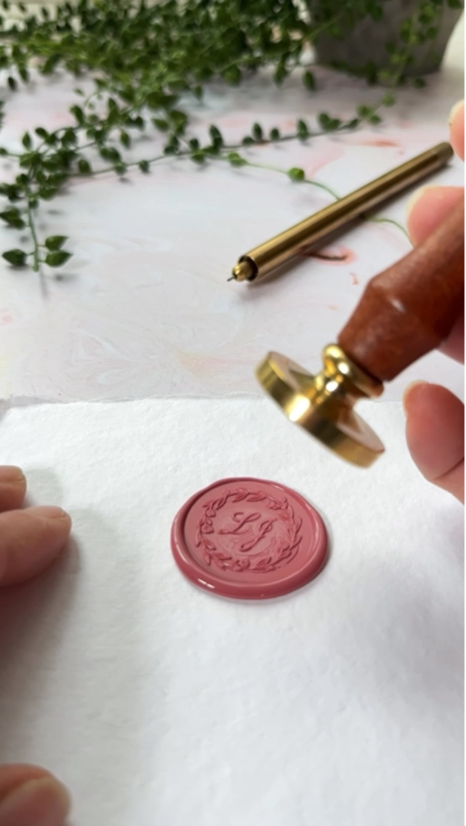 video showing how to make custom wax seals with a customised sealing wax stamp