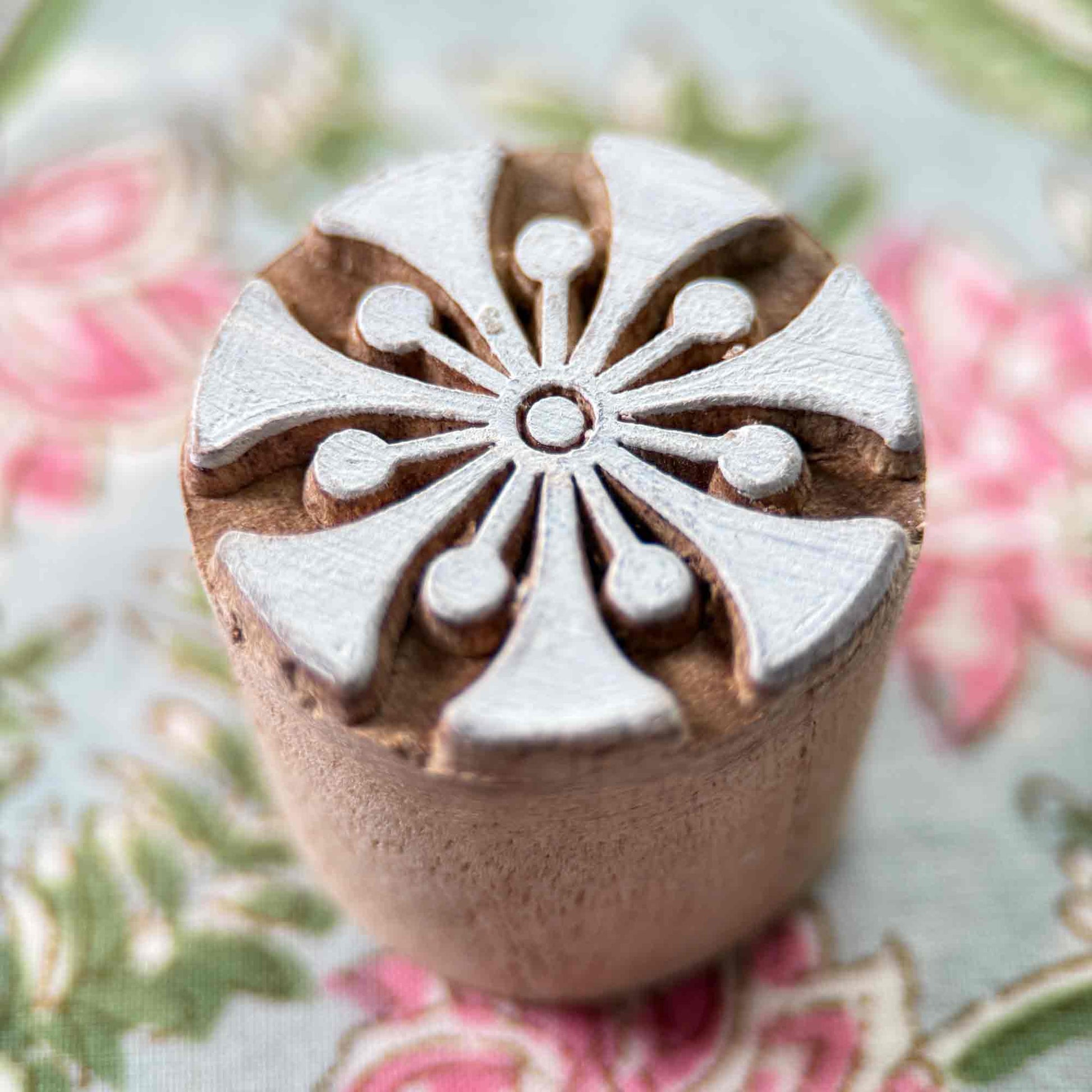Decorative wood block stamp with a floral design 