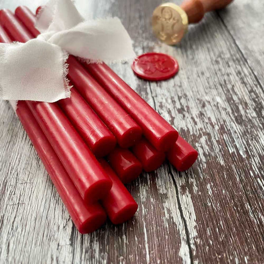 Berry red sealing wax sticks to make bright red wax seals.  Perfect for seasonal projects.  Eco friendly wax seal wax.  Plastic free, paraffin free and biodegradable.  By The Natural Paper Company