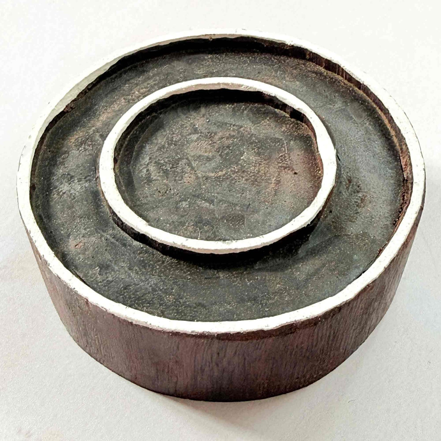 Indian wood block stamp — Rings design, two concentric outlines viewed from angle, showing carved depth and smooth band texture, handcrafted wooden stamp, authentic traditional printing block from India