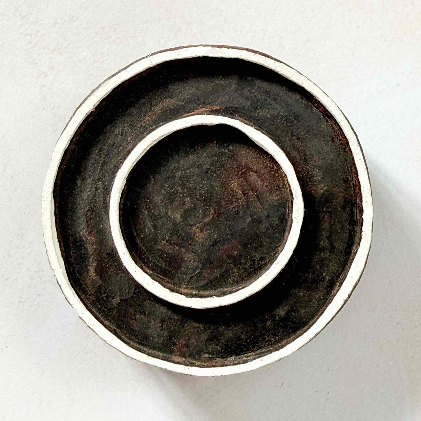 Indian wood block stamp — Rings double circle face-on view on soft pale background, clean inner and outer ring design, hand-carved wooden stamp, classic traditional printing block minimal motif