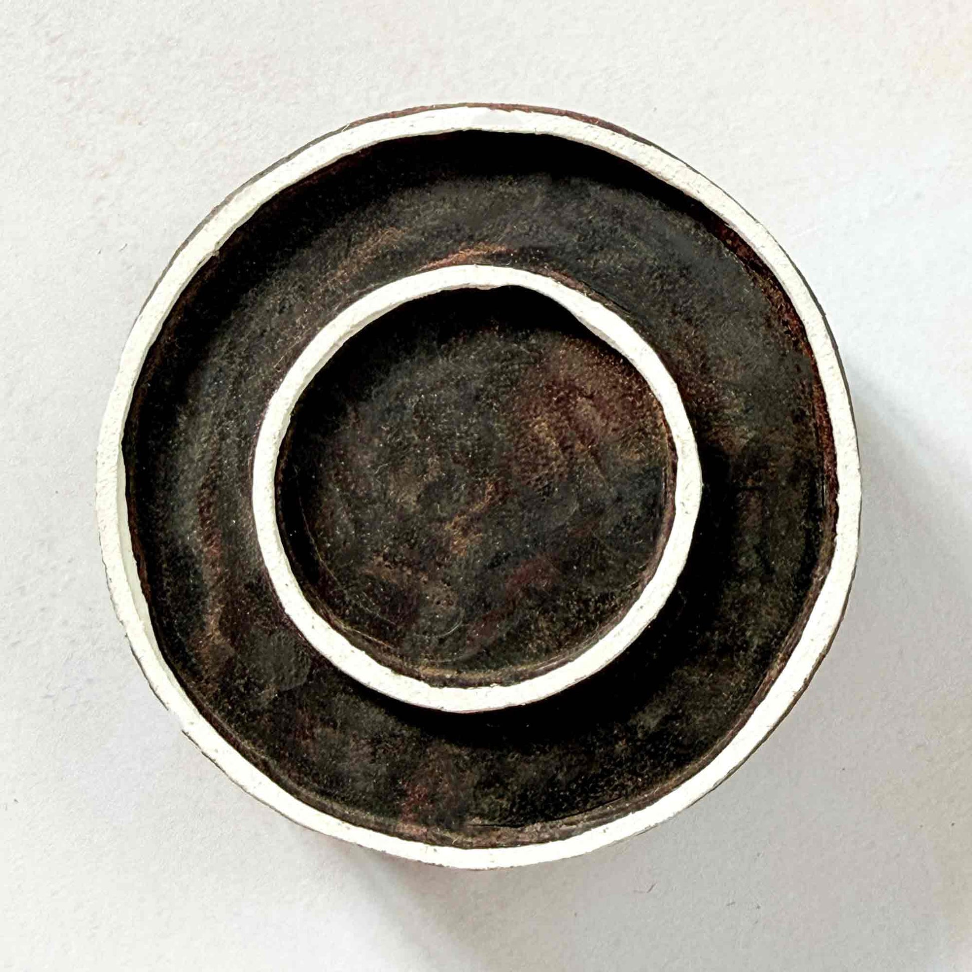 Indian wood block stamp — Rings double circle face-on view on soft pale background, clean inner and outer ring design, hand-carved wooden stamp, classic traditional printing block minimal motif