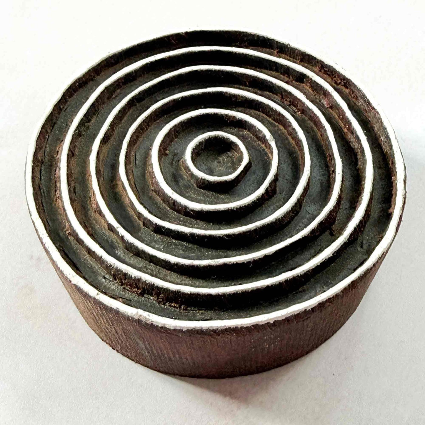 Indian wood block stamp — Ripple concentric rings viewed from angle, showing carved depth and smooth curved band texture, handcrafted wooden stamp, premium traditional printing block hardwood
