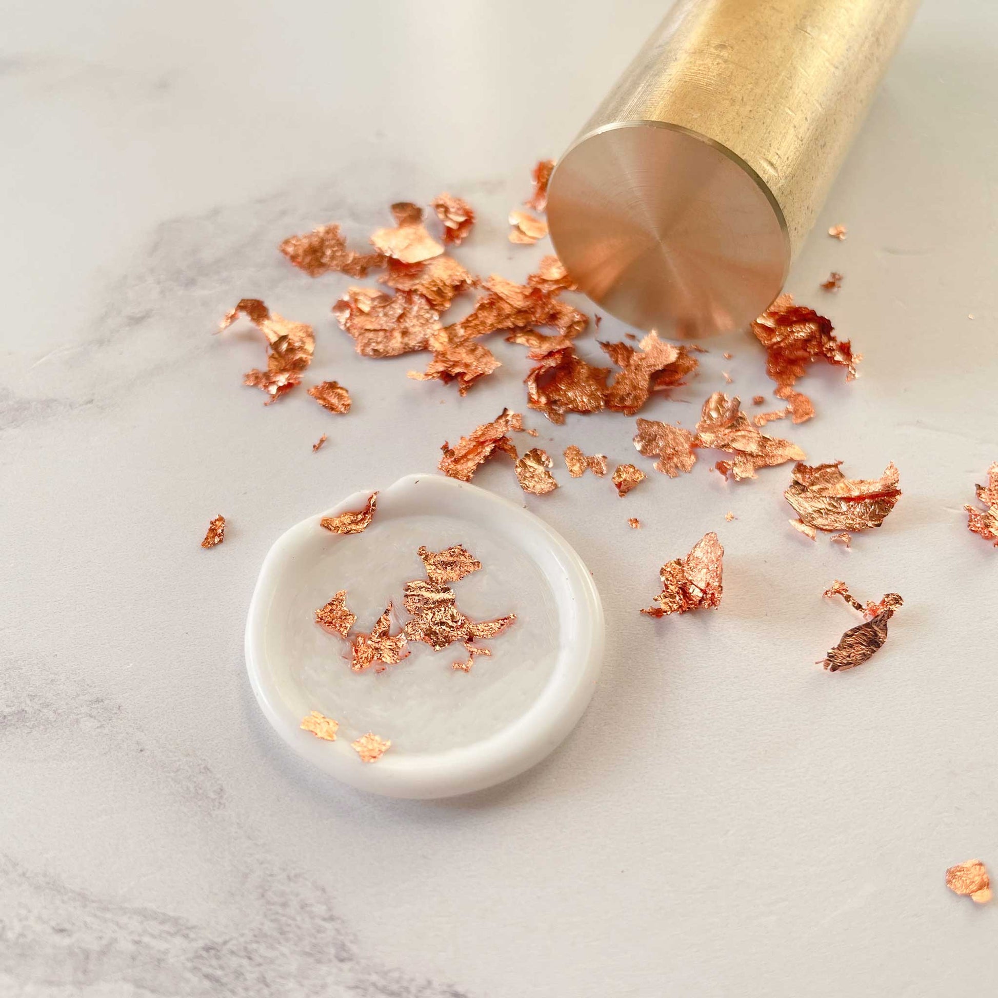 Rose gold leaf flakes for decorating wax seals.  Metallic flakes in copper.  By The Natural Paper Company