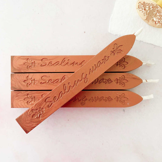 rose gold sealing wax sticks with wick.  Make rose gold wax seals and stamps.