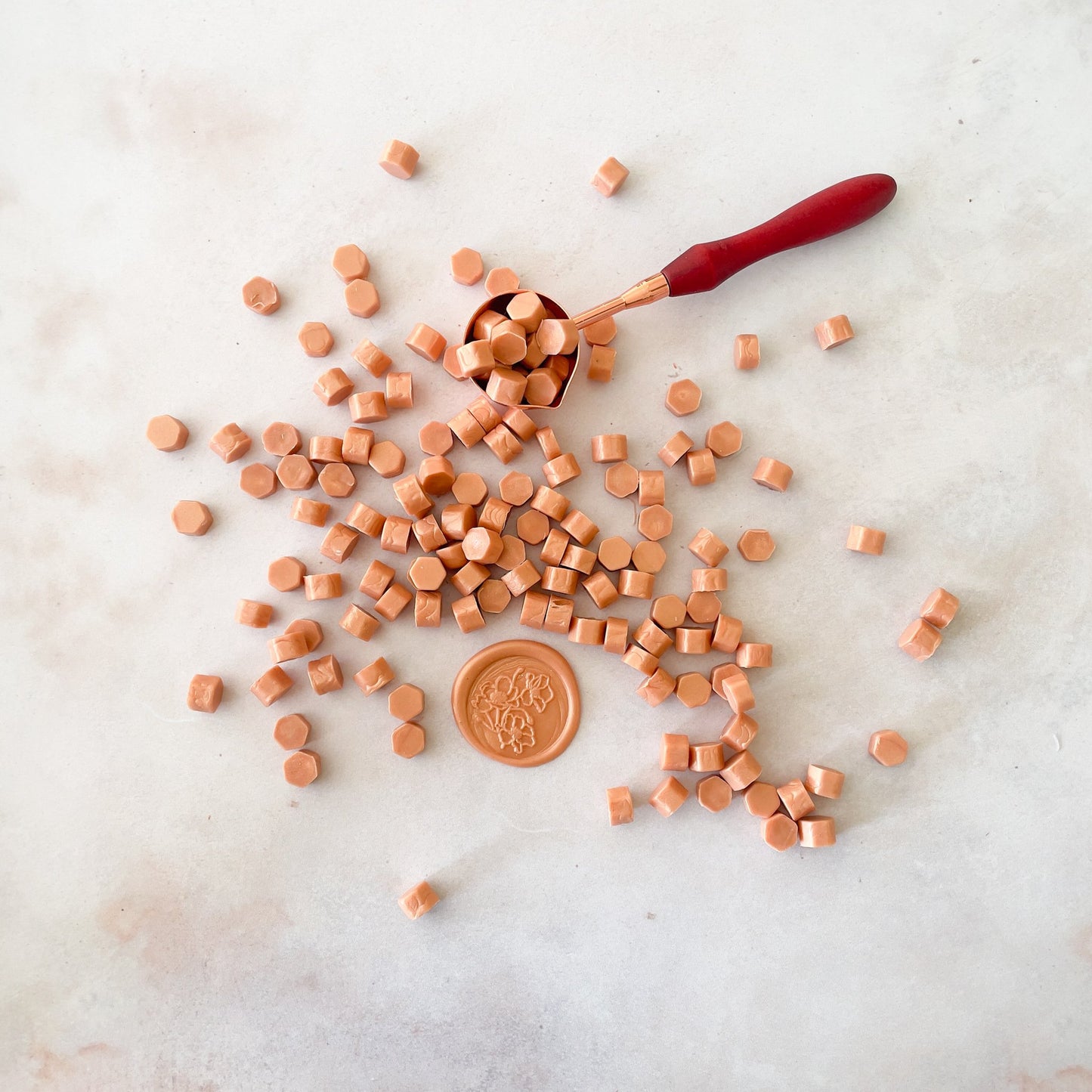 Rose gold sealing wax beads to make wax seals.  Eco friendly wax for use with a melting spoon and wax stamp.  by The Natural Paper Company