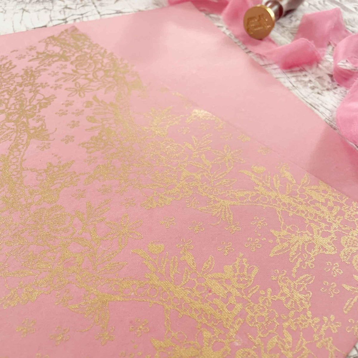 Pink Robe Paper Recycled Cotton rag paper in rose pink with a gold pattern