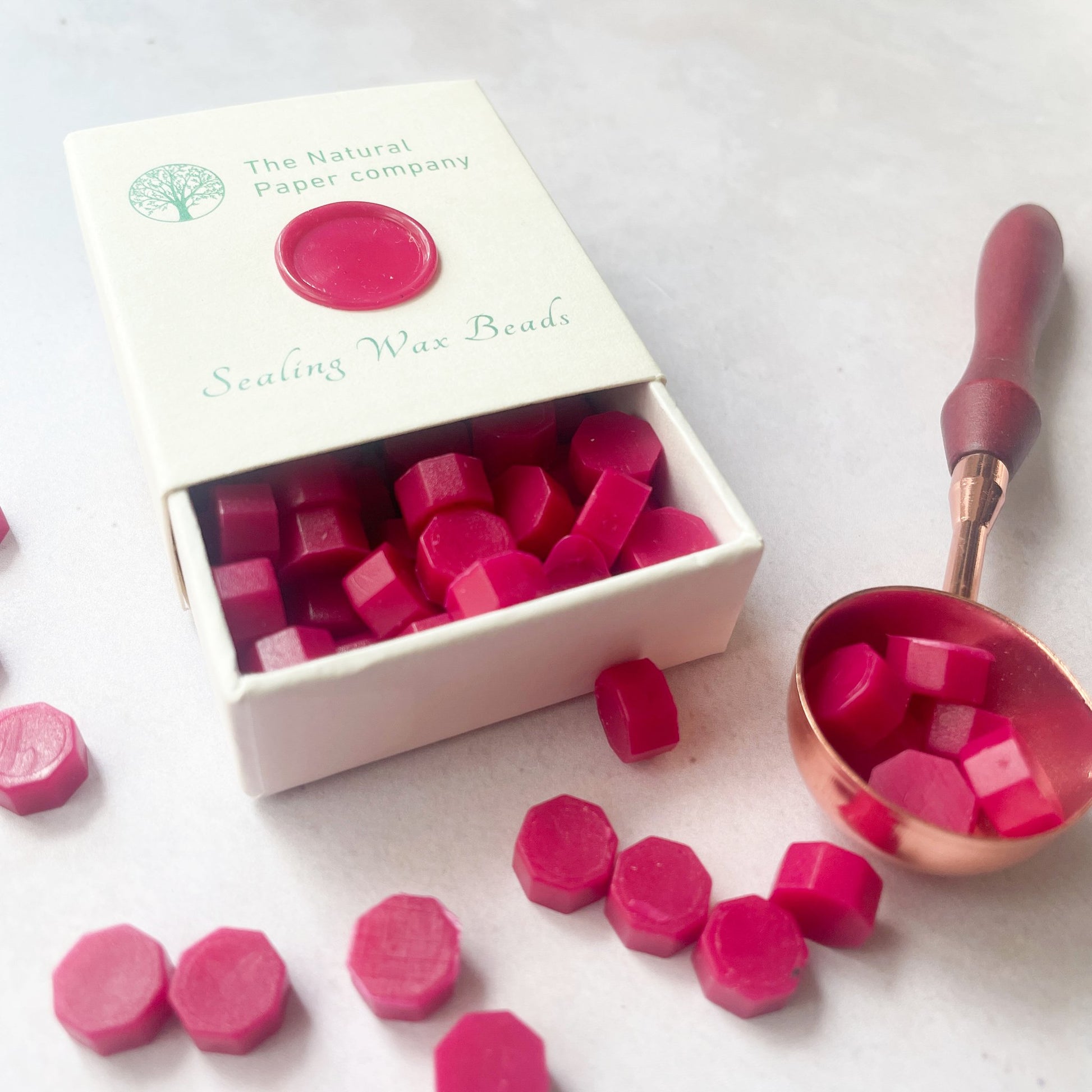 Sealing wax beads in ruby red colour.  Box of eco friendly wax to make wax seals in cherry red.  By The Natural paper Company