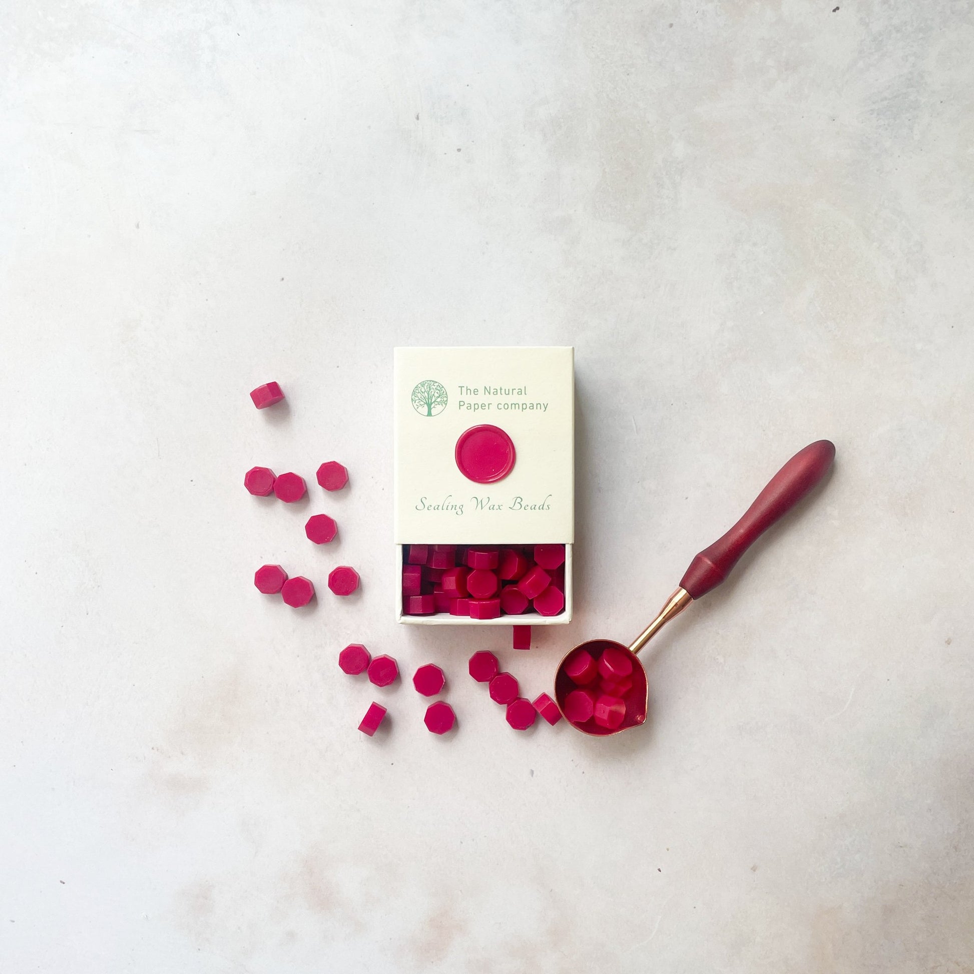 Ruby Red sealing wax beads to make wax seals.  Eco friendly wax for making wax seals to decorating wedding invitations, stationery and packaging.  By The Natural paper Company