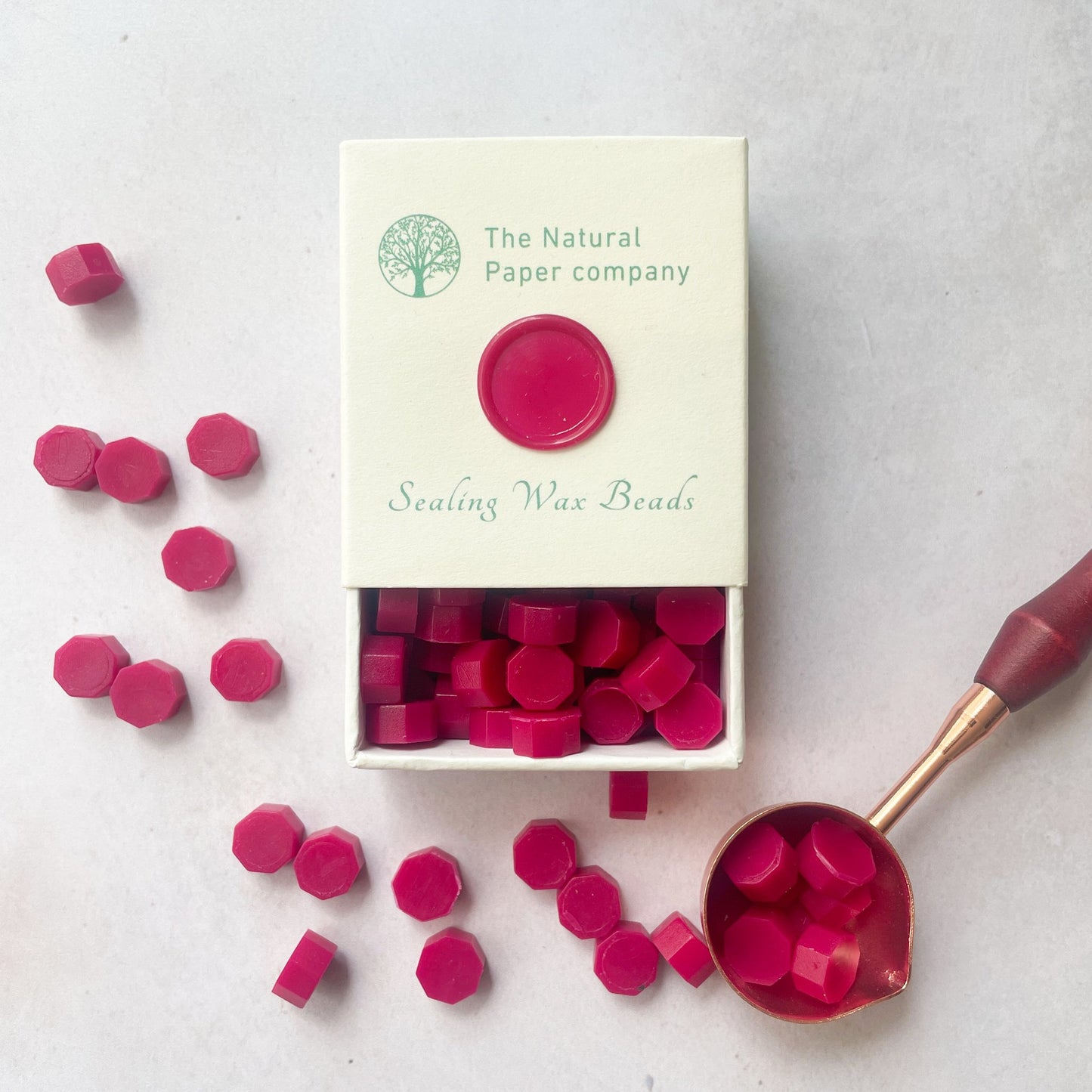 Box of ruby red sealing wax beads By The Natural paper Company.  Make eco friendly wax seals in cherry red.  By The Natural paper Company