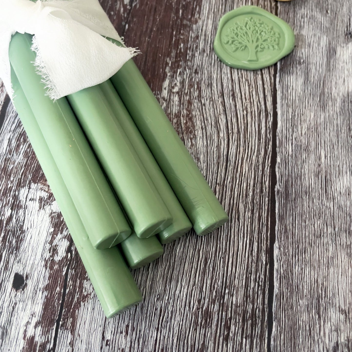 Sage green sealing wax sticks made from eco friendly wax.  Plastic free, paraffin free and biodegradable.  Make khaki green wax seals with a sealing wax gun or melting spoon.  By The Natural Paper Company