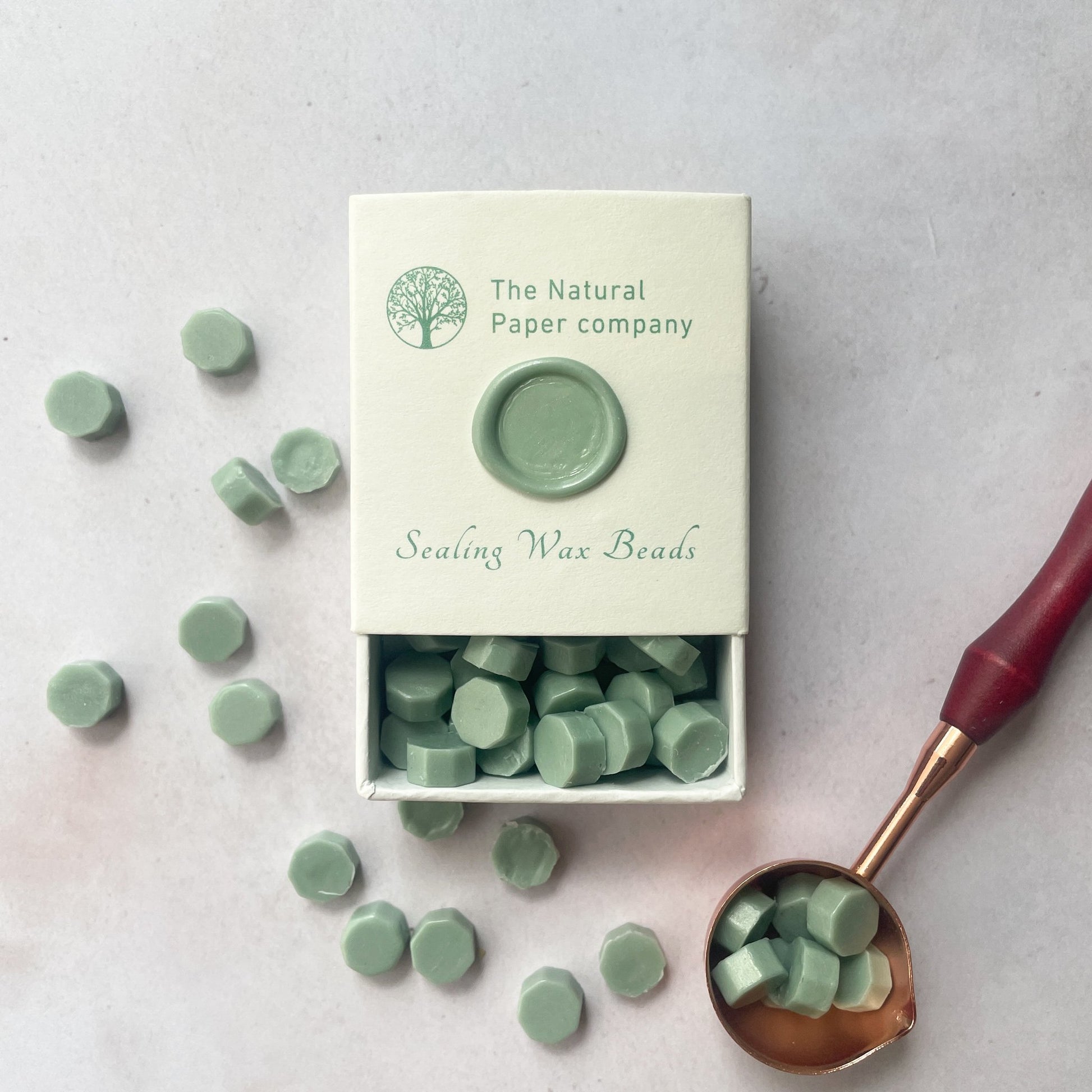 Box of sage green sealing wax beads by The Natural paper Company.  Eco friendly wax for making wax seals.  By The Natural paper Company