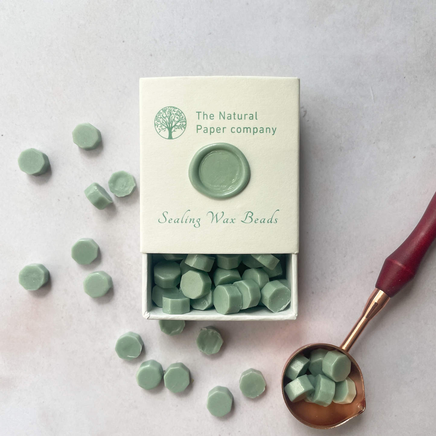 box of sage green sealing wax beads for making wax stamps and seals