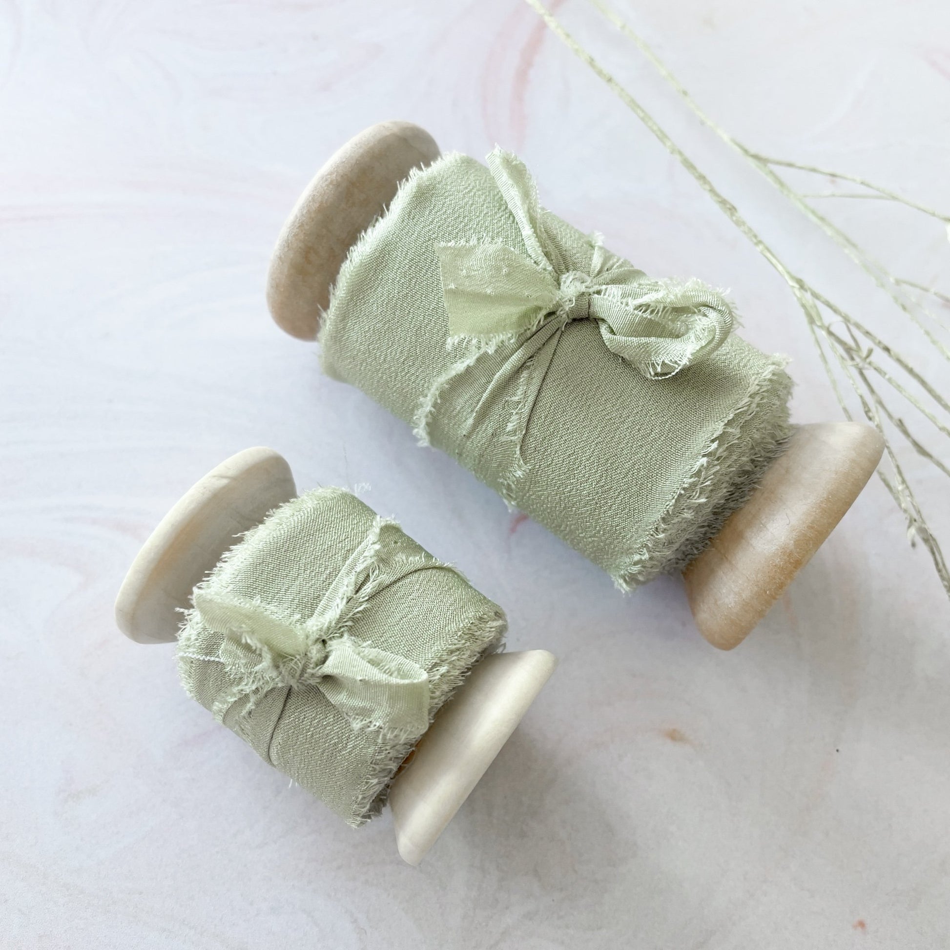 Sage green silk ribbon for crafts.  Luxury silk ribbon on a wooden reel.  Perfect for floristry and wedding stationery.  By The Natural Paper Company.